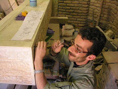 Here, the ustad (master craftsman) is adding more small pieces of the ‘artificial stone’ to smaller defects in the memorial. Unusually, this ustad is a young man – most are much older