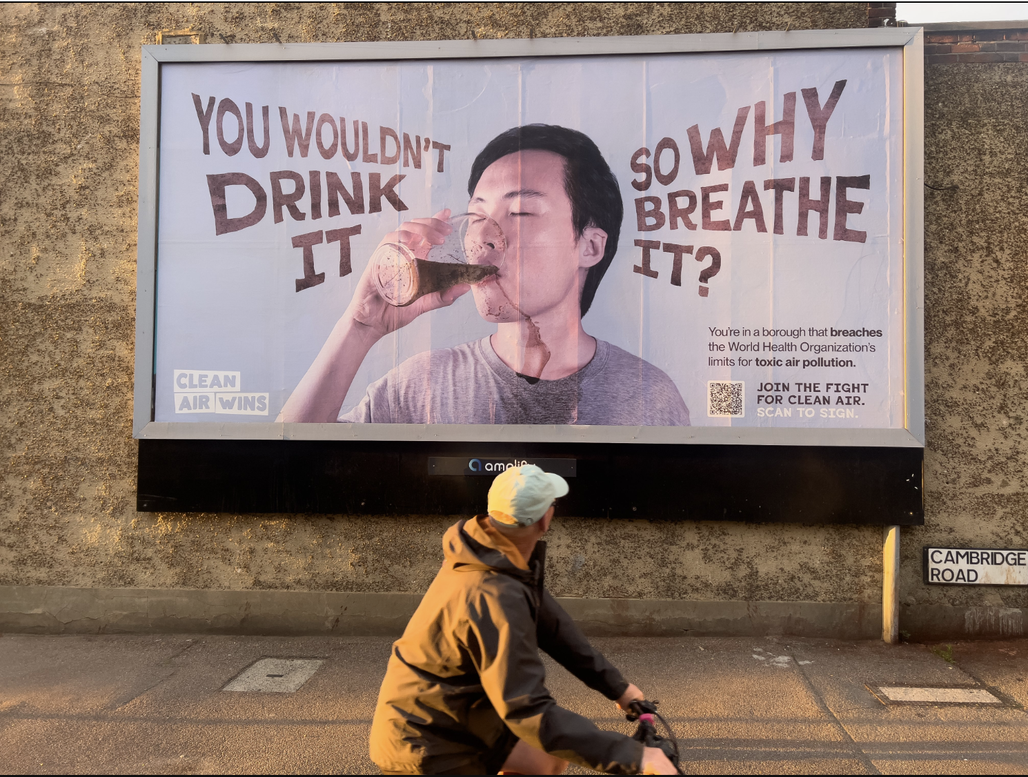 poster in street says: you wouldnt drink it - so why breath it
